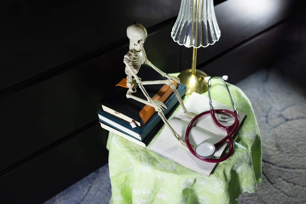 Notebooks, stationery and educational materials on a table with medical supplies
